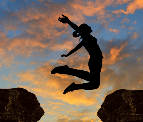 Picture of a lady jumping during the sunrise for the piece of a mind