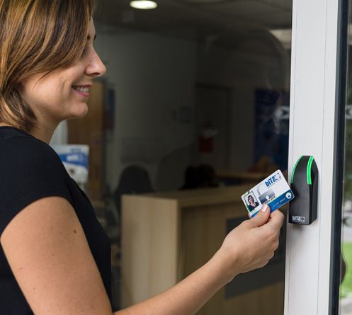 Picture of a woman using an Architect reader with a MA1 by STid Security